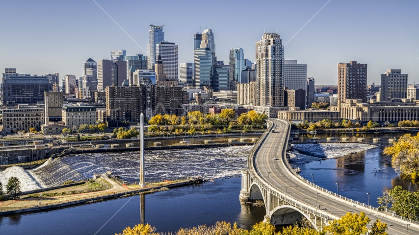 The city's skyline on the opposite side of a bridge across the Mississippi River, Downtown Minneapolis, Minnesota Aerial Stock Photo DXP001_000296 | Axiom Images