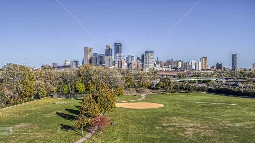 The city's skyline in the distance, seen from a neighborhood park, Downtown Minneapolis, Minnesota Aerial Stock Photo DXP001_000309 | Axiom Images