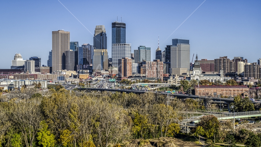 The city's skyline seen from a cluster of trees at a park, Downtown Minneapolis, Minnesota Aerial Stock Photo DXP001_000310 | Axiom Images