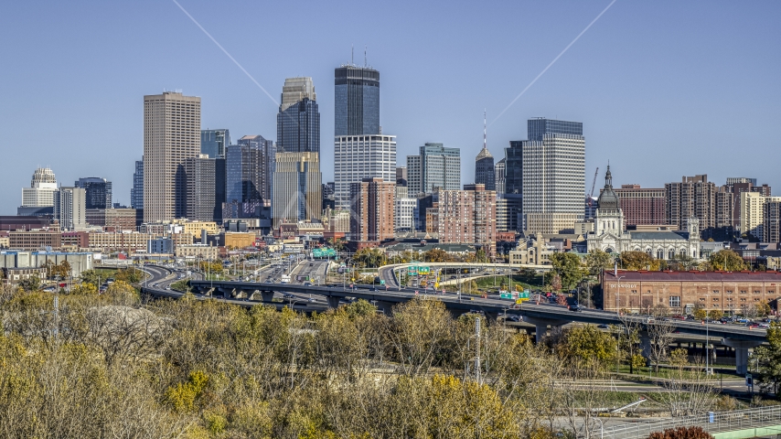 The city's skyline behind the I-394 freeway, seen from a cluster of trees, Downtown Minneapolis, Minnesota Aerial Stock Photo DXP001_000312 | Axiom Images