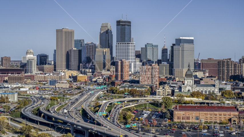 The city's skyline behind the I-394 freeway interchange with light traffic, Downtown Minneapolis, Minnesota Aerial Stock Photo DXP001_000313 | Axiom Images