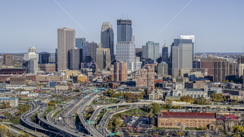The city's downtown skyline behind the I-394 freeway interchange with light traffic, Downtown Minneapolis, Minnesota Aerial Stock Photo DXP001_000314 | Axiom Images