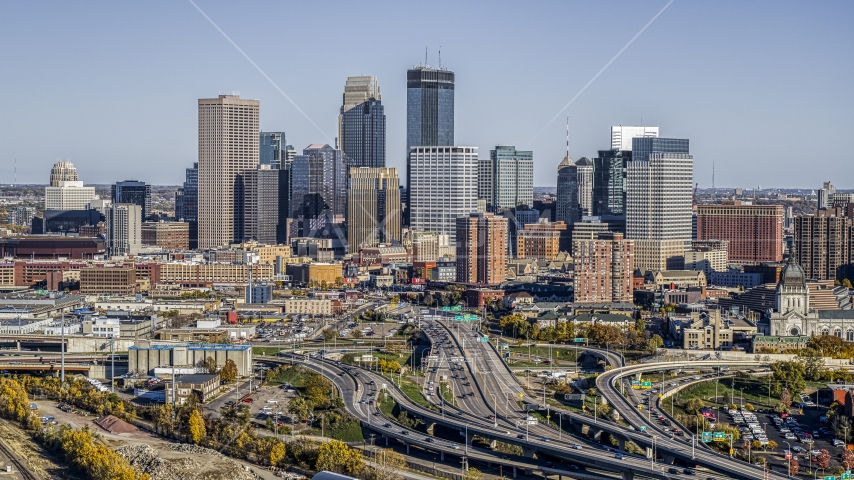 The city skyline's skyscrapers seen from the I-394 freeway interchange with light traffic, Downtown Minneapolis, Minnesota Aerial Stock Photo DXP001_000315 | Axiom Images