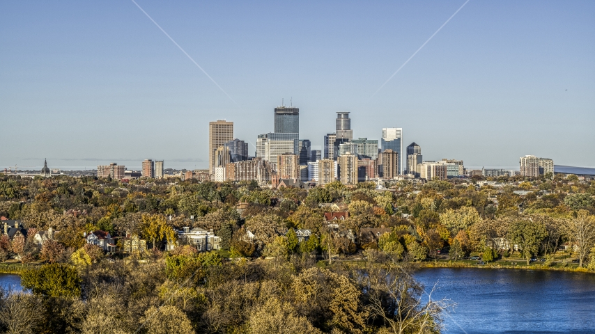 Lakefront neighborhoods and city skyline seen from Lake of the Isles, Downtown Minneapolis, Minnesota Aerial Stock Photo DXP001_000318 | Axiom Images