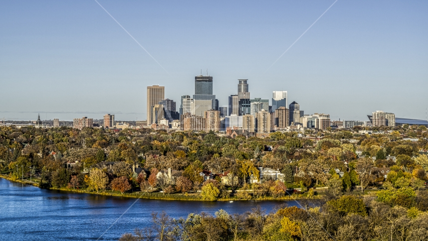 Waterfront neighborhoods and city skyline seen from Lake of the Isles, Downtown Minneapolis, Minnesota Aerial Stock Photo DXP001_000319 | Axiom Images
