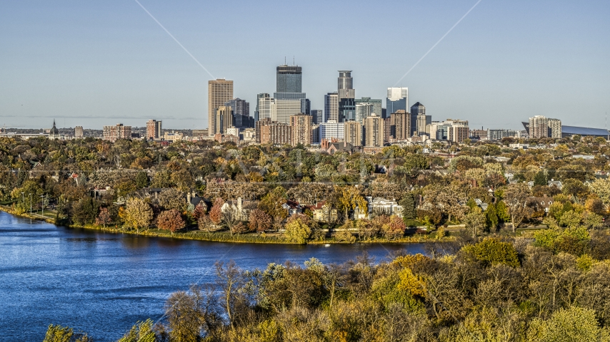 Waterfront homes and city skyline seen from Lake of the Isles, Downtown Minneapolis, Minnesota Aerial Stock Photo DXP001_000320 | Axiom Images