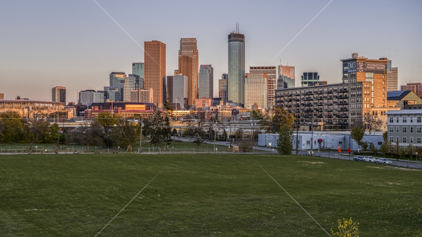 Giant skyscrapers of the city's skyline at sunset seen from a park in Downtown Minneapolis, Minnesota Aerial Stock Photo DXP001_000325 | Axiom Images