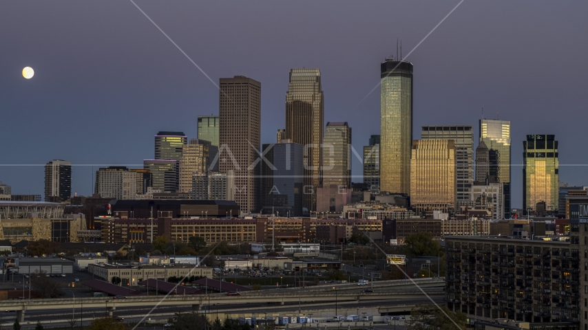 The moon by the skyscrapers of the city's skyline at twilight, Downtown Minneapolis, Minnesota Aerial Stock Photo DXP001_000338 | Axiom Images