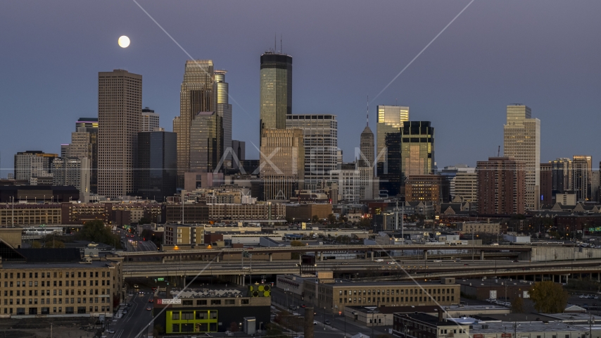 The skyscrapers of the city's skyline at twilight, moon in the sky above, Downtown Minneapolis, Minnesota Aerial Stock Photo DXP001_000339 | Axiom Images