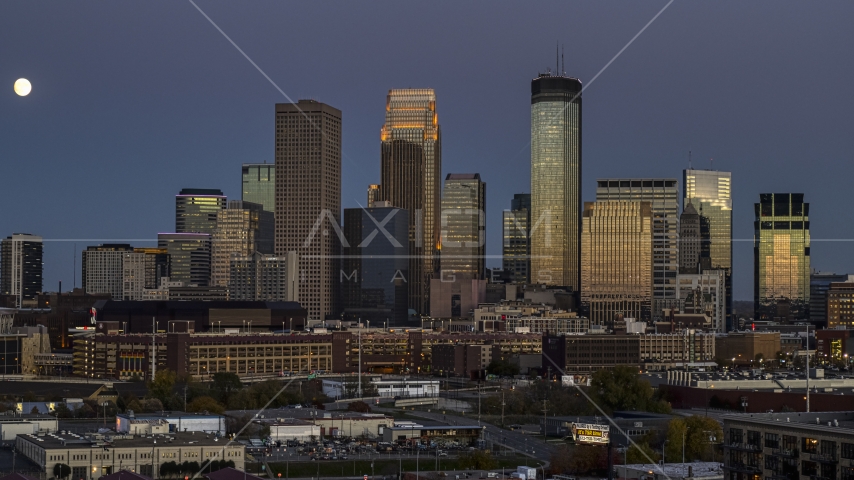A view of the city's skyline at twilight, moon in the sky near skyscrapers, Downtown Minneapolis, Minnesota Aerial Stock Photo DXP001_000342 | Axiom Images