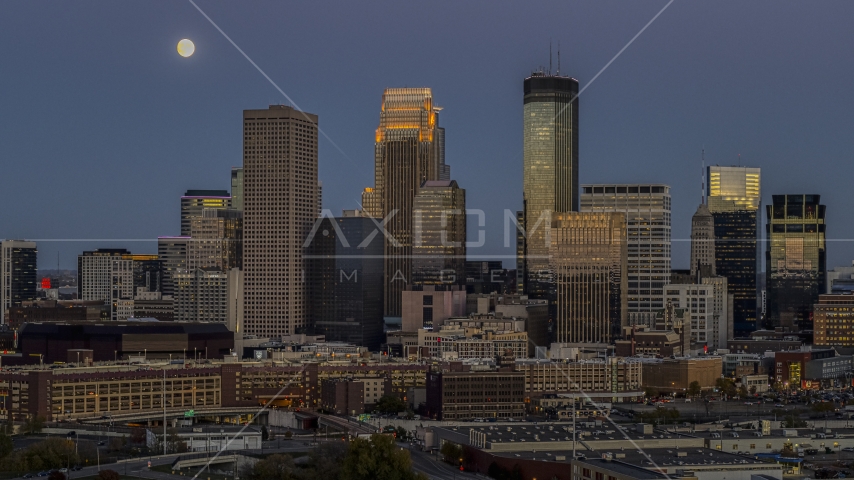 A view of the city's skyline at twilight, moon in the sky above skyscrapers, Downtown Minneapolis, Minnesota Aerial Stock Photo DXP001_000343 | Axiom Images
