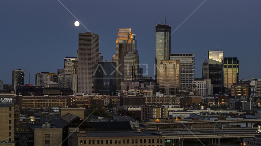 A view of the city's skyline at twilight, moon above skyscrapers, Downtown Minneapolis, Minnesota Aerial Stock Photo DXP001_000344 | Axiom Images