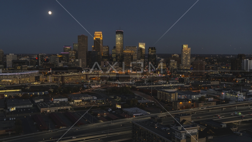 A wide view of the city's skyline at twilight with the moon in the sky, Downtown Minneapolis, Minnesota Aerial Stock Photo DXP001_000347 | Axiom Images