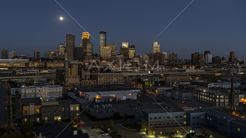 The city's downtown skyline at twilight with the moon in the sky, Downtown Minneapolis, Minnesota Aerial Stock Photo DXP001_000349 | Axiom Images