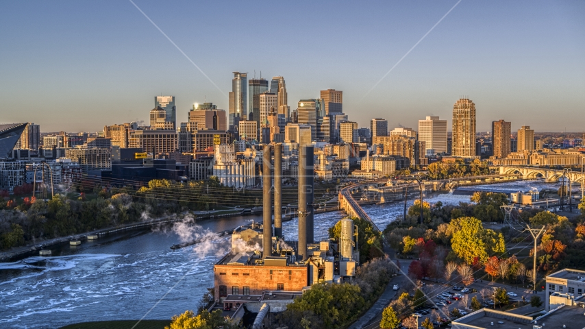 The downtown skyline across the river, seen from power plant at sunrise, Downtown Minneapolis, Minnesota Aerial Stock Photo DXP001_000352 | Axiom Images
