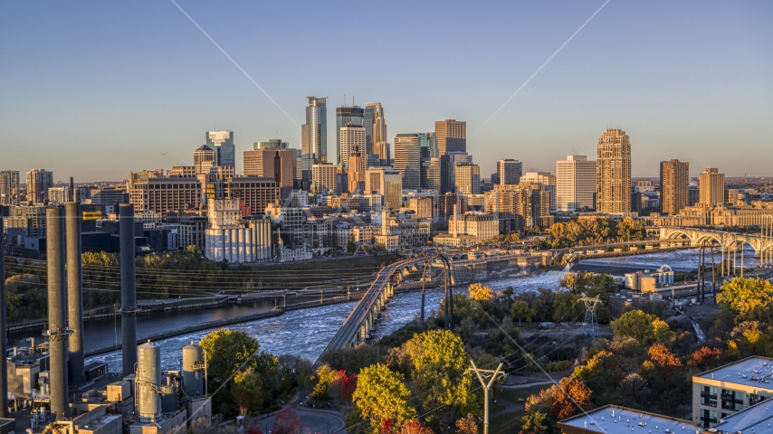 The downtown skyline across the river, seen from a bridge at sunrise, Downtown Minneapolis, Minnesota Aerial Stock Photo DXP001_000353 | Axiom Images