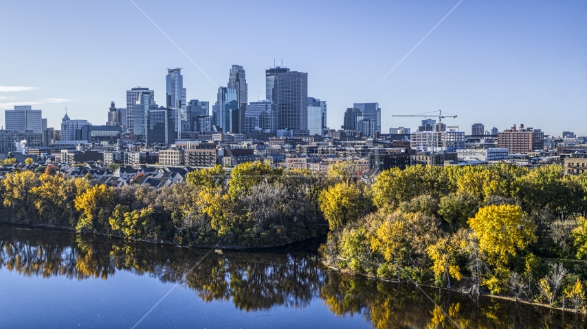The tree-lined river and the city skyline in the distance, Downtown Minneapolis, Minnesota Aerial Stock Photo DXP001_000362 | Axiom Images