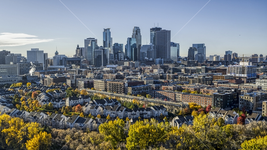The city's skyline in the distance, seen from a neighborhood, Downtown Minneapolis, Minnesota Aerial Stock Photo DXP001_000366 | Axiom Images