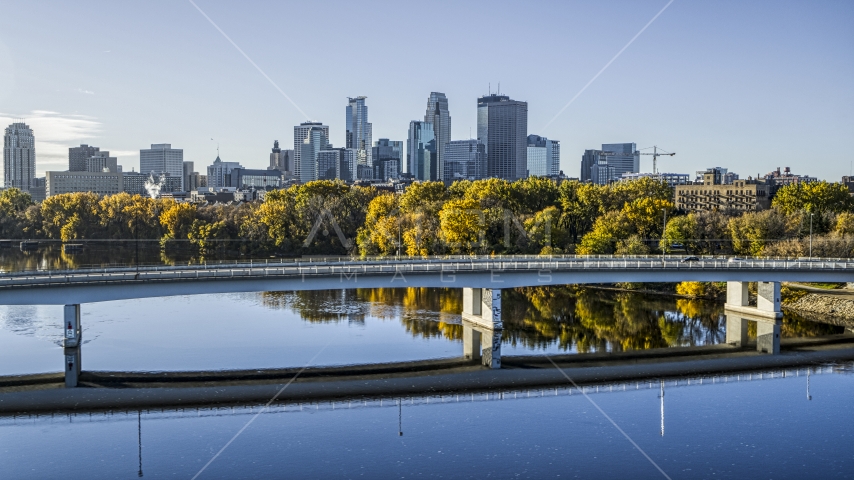 Bridge spanning the Mississippi River, city skyline in background, Downtown Minneapolis, Minnesota Aerial Stock Photo DXP001_000368 | Axiom Images