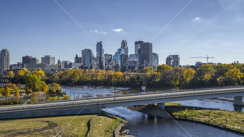 City skyline's skyscrapers seen from a bridge spanning the Mississippi River, Downtown Minneapolis, Minnesota Aerial Stock Photo DXP001_000395 | Axiom Images