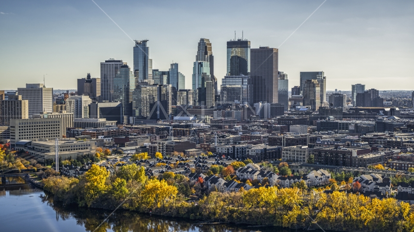 The city's skyline seen from the Mississippi River with autumn trees, Downtown Minneapolis, Minnesota Aerial Stock Photo DXP001_000404 | Axiom Images