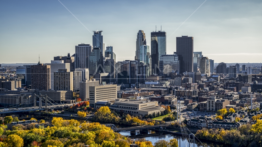 A view over autumn trees by the Mississippi River of the city's skyline, Downtown Minneapolis, Minnesota Aerial Stock Photo DXP001_000406 | Axiom Images