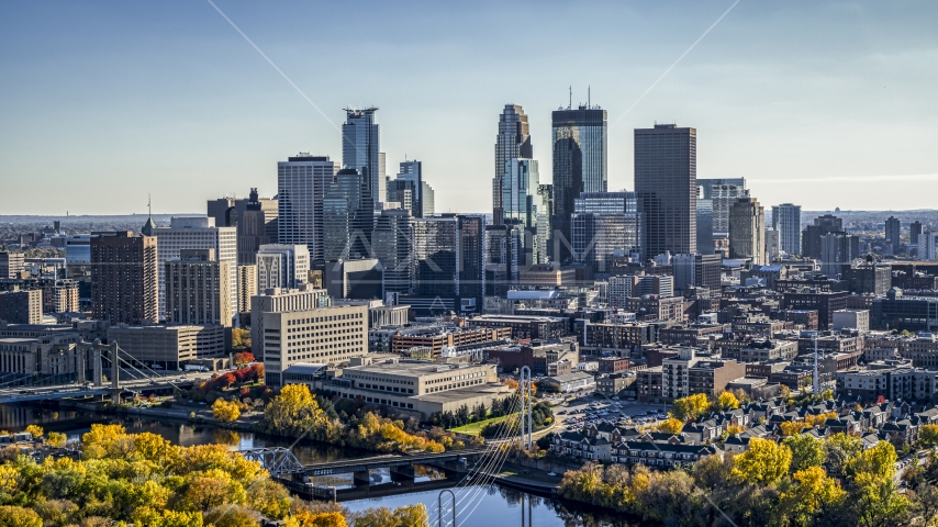 The city's skyline seen from autumn trees by the river, Downtown Minneapolis, Minnesota Aerial Stock Photo DXP001_000407 | Axiom Images