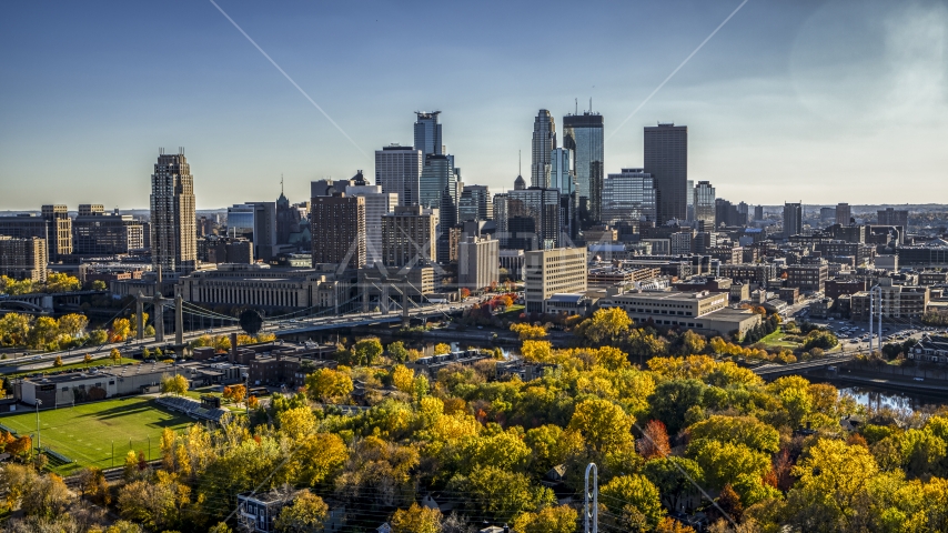 The towering skyline seen from a park by the river, Downtown Minneapolis, Minnesota Aerial Stock Photo DXP001_000410 | Axiom Images