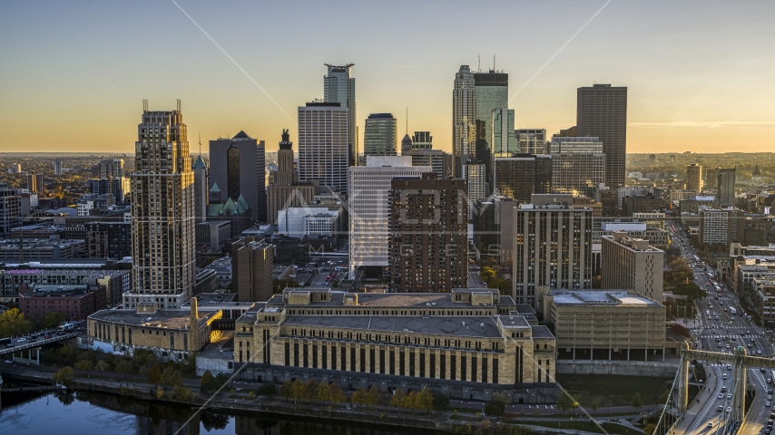 Apartment complex and USPS building at sunset, skyline in background, Downtown Minneapolis, Minnesota Aerial Stock Photo DXP001_000419 | Axiom Images