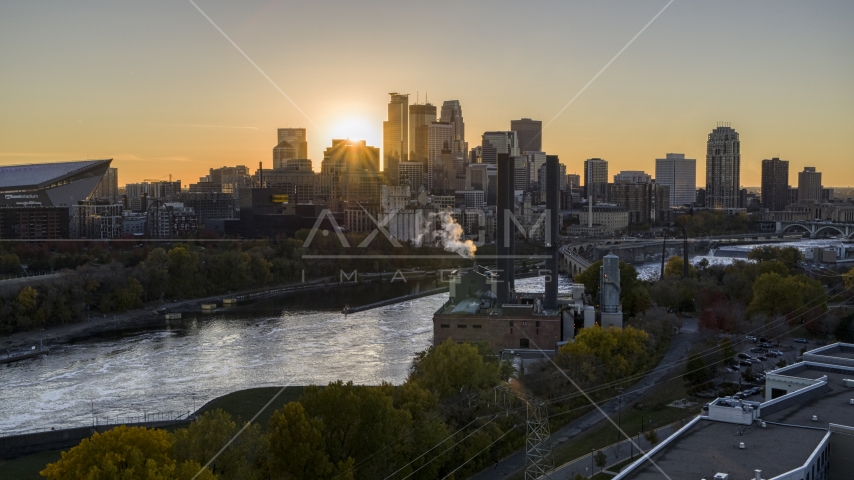The skyline across the Mississippi River, seen from a power plant at sunset, Downtown Minneapolis, Minnesota Aerial Stock Photo DXP001_000421 | Axiom Images