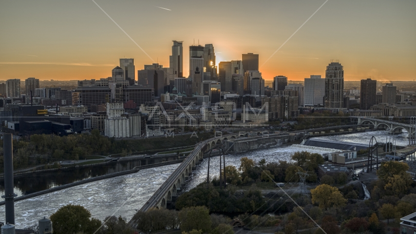 The city skyline, seen from a bridge over the Mississippi River at sunset, Downtown Minneapolis, Minnesota Aerial Stock Photo DXP001_000426 | Axiom Images