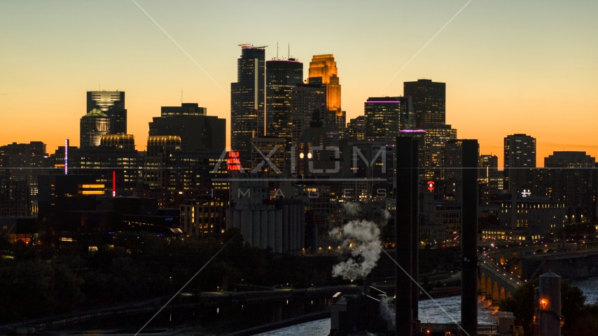 The city skyline lit up for the night at twilight, Downtown Minneapolis, Minnesota Aerial Stock Photo DXP001_000443 | Axiom Images