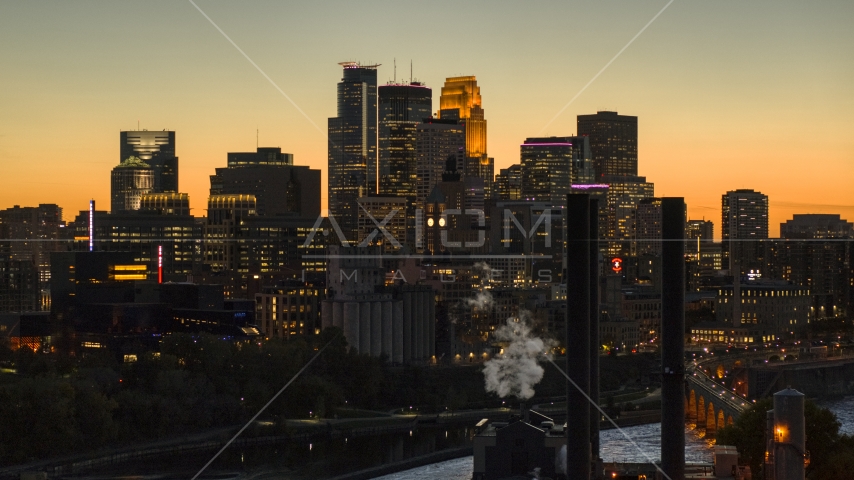The downtown skyline lit up for the night at twilight, Downtown Minneapolis, Minnesota Aerial Stock Photo DXP001_000444 | Axiom Images