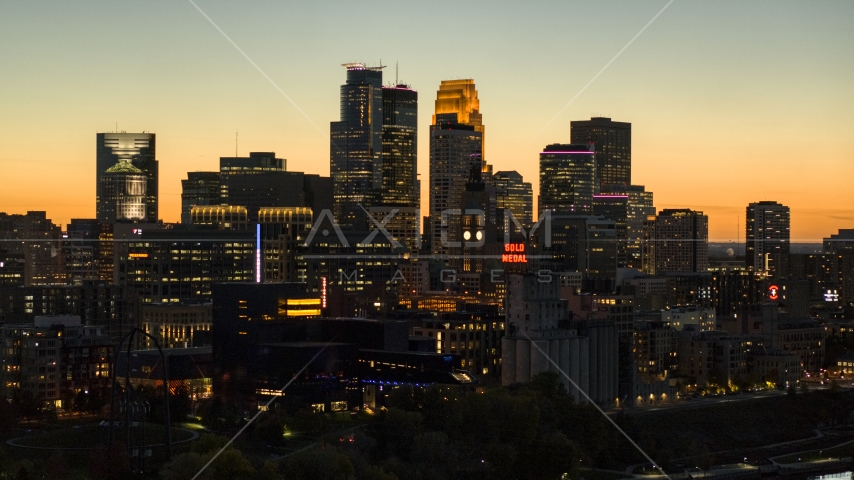 The skyscrapers in the downtown skyline lit up for the night at twilight, Downtown Minneapolis, Minnesota Aerial Stock Photo DXP001_000445 | Axiom Images