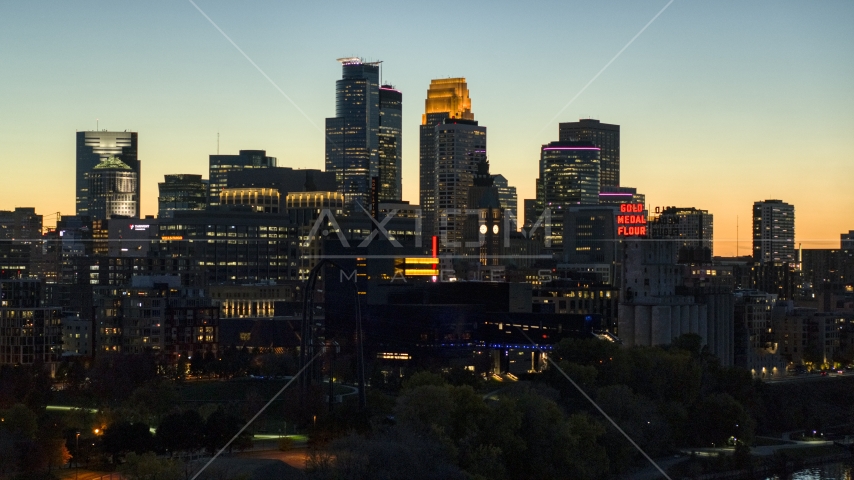 The skyscrapers in the city's skyline lit up for the night at twilight, Downtown Minneapolis, Minnesota Aerial Stock Photo DXP001_000446 | Axiom Images