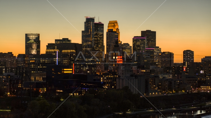 Tall skyscrapers in the city's skyline lit up for the night at twilight, Downtown Minneapolis, Minnesota Aerial Stock Photo DXP001_000447 | Axiom Images