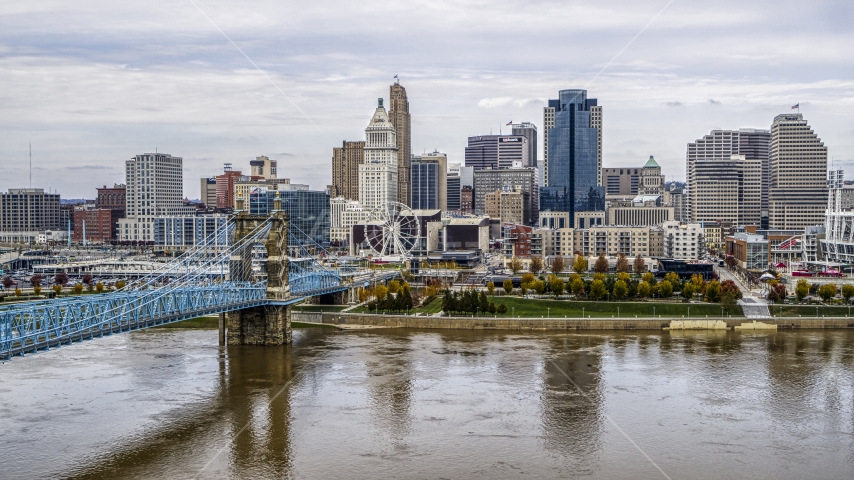 The city's skyline and Roebling Bridge spanning the Ohio River, Downtown Cincinnati, Ohio Aerial Stock Photo DXP001_000452 | Axiom Images