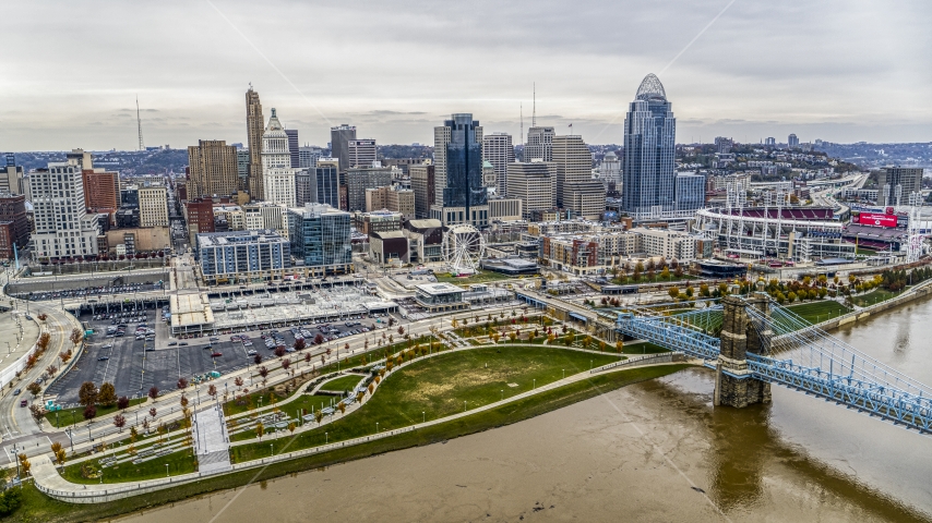 The city's skyline behind a riverfront park by the Ohio River in Downtown Cincinnati, Ohio Aerial Stock Photo DXP001_000483 | Axiom Images