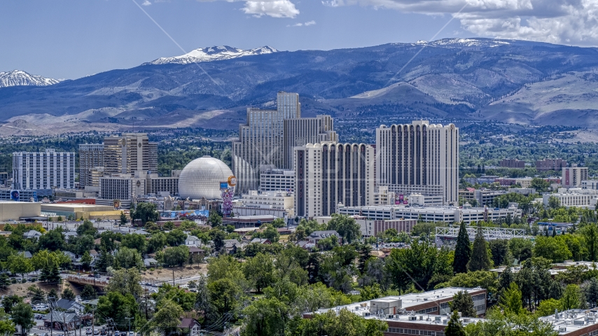 Resort hotels and casinos with mountains in the distance in Reno, Nevada Aerial Stock Photo DXP001_004_0003 | Axiom Images