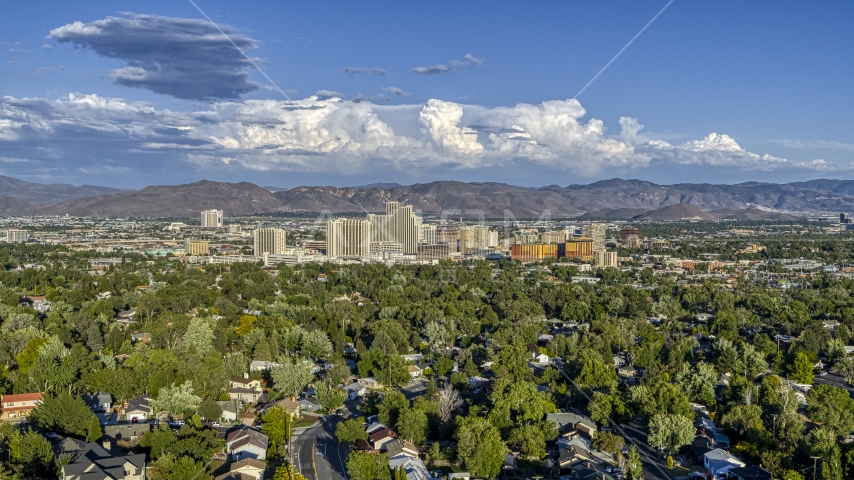 City skyline seen from tree-lined neighborhoods in Reno, Nevada Aerial Stock Photo DXP001_005_0005 | Axiom Images