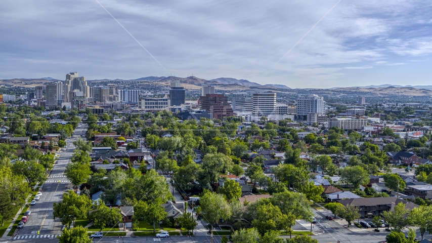 Casino resorts and office buildings seen from neighborhood with trees in Reno, Nevada Aerial Stock Photo DXP001_006_0015 | Axiom Images