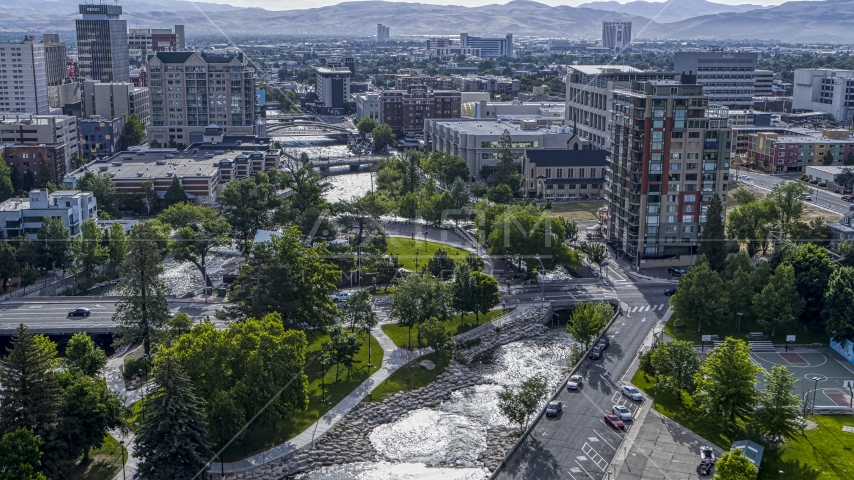 The Truckee River and Wingfield Park by office buildings in Reno, Nevada Aerial Stock Photo DXP001_006_0017 | Axiom Images