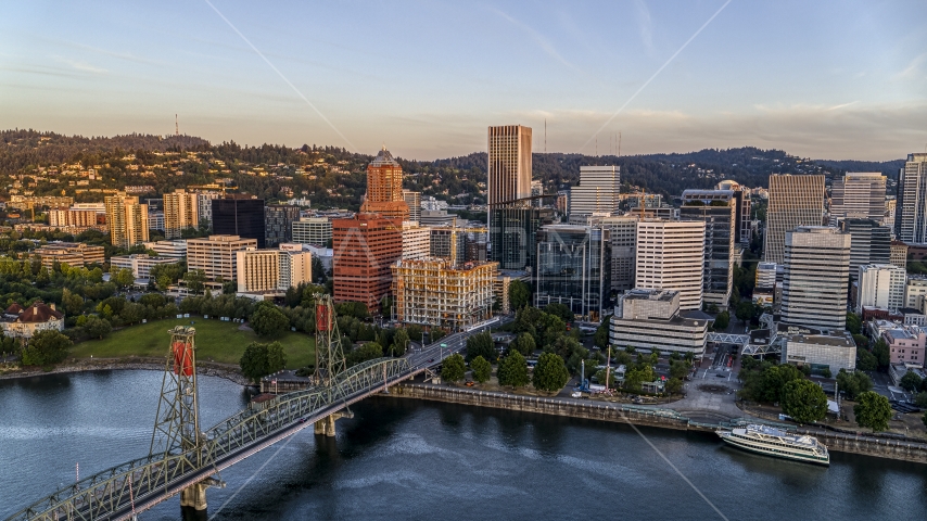 Tall skyscrapers and the Hawthorne Bridge spanning the Willamette River, Downtown Portland, Oregon Aerial Stock Photo DXP001_010_0007 | Axiom Images