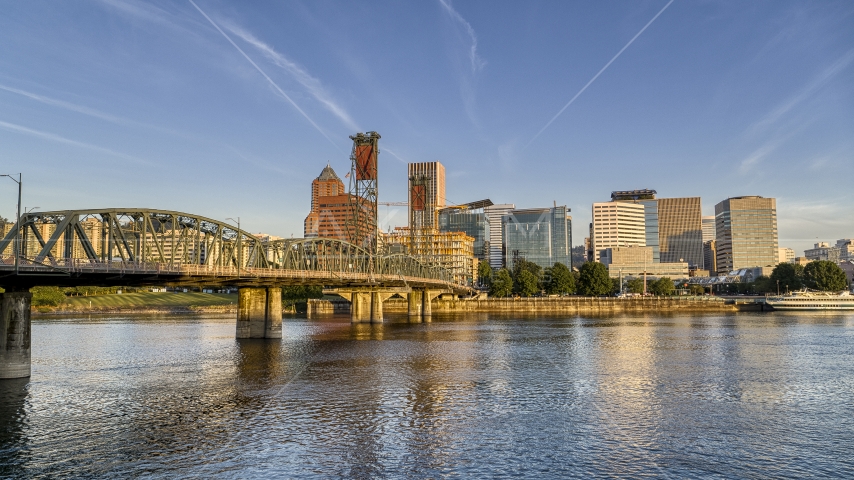 The city skyline behind the Hawthorne Bridge seen from the Willamette River, Downtown Portland, Oregon Aerial Stock Photo DXP001_010_0012 | Axiom Images