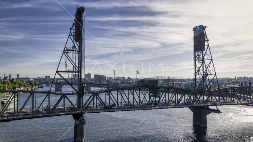 Cars crossing the Hawthorne Bridge spanning the Willamette River in Downtown Portland, Oregon Aerial Stock Photo DXP001_011_0018 | Axiom Images