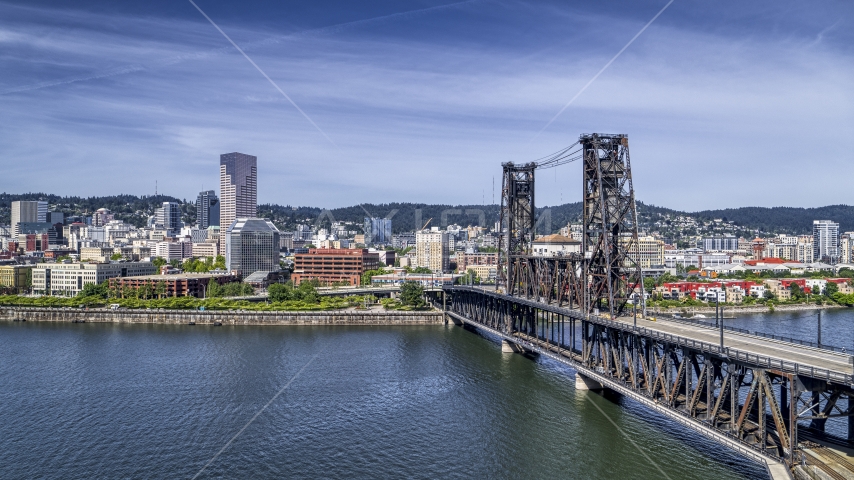 Steel Bridge and waterfront buildings in Downtown Portland, Oregon Aerial Stock Photo DXP001_012_0001 | Axiom Images