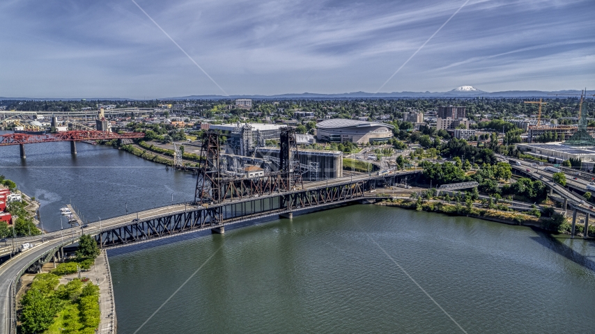 The Steel Bridge spanning the Willamette River near Moda Center arena, Northeast Portland, Oregon Aerial Stock Photo DXP001_012_0006 | Axiom Images