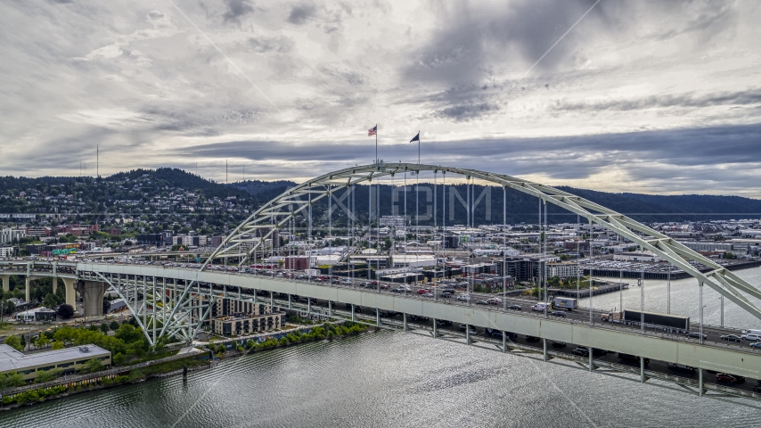 Traffic crossing the Fremont Bridge spanning the Willamette River in Downtown Portland, Oregon Aerial Stock Photo DXP001_013_0003 | Axiom Images