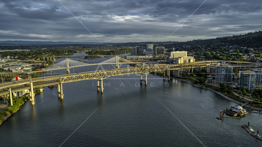 The Marquam and Tilikum Crossing bridges spanning the Willamette River at sunset in South Portland, Oregon Aerial Stock Photo DXP001_014_0002 | Axiom Images