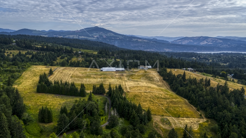 A farm and fields in Hood River, Oregon Aerial Stock Photo DXP001_015_0010 | Axiom Images